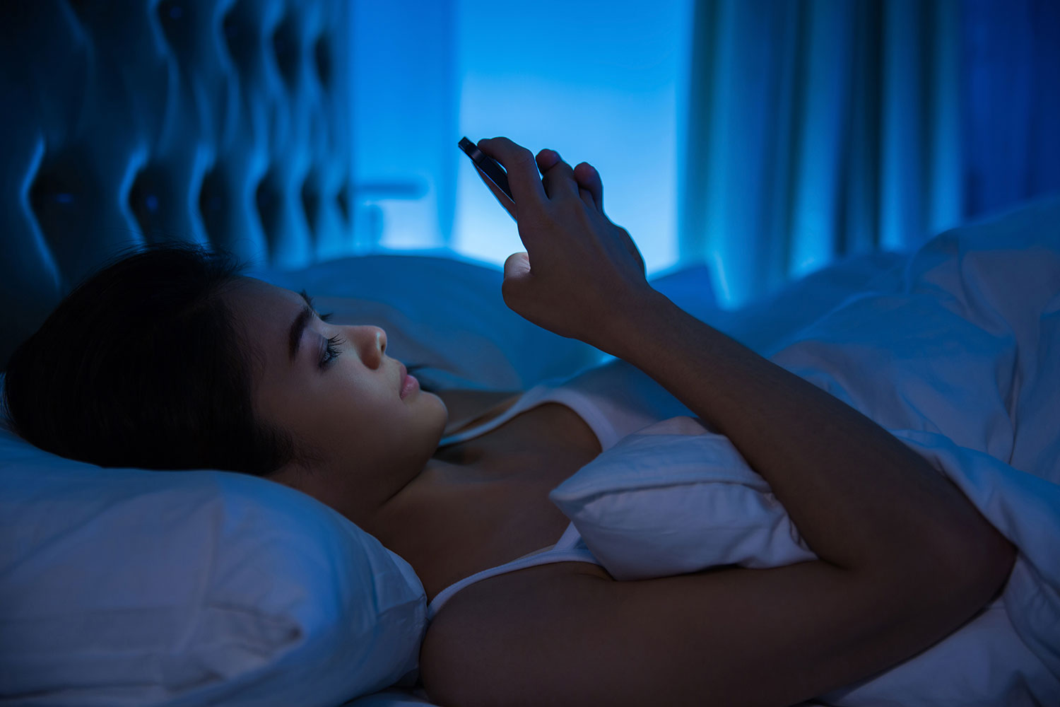 Woman awake in bed